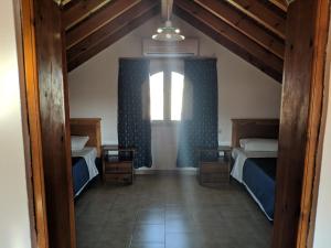 Postel nebo postele na pokoji v ubytování Tondoris Apartments
