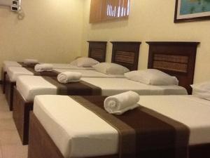 a row of mattresses lined up in a room at Darunday Manor in Tagbilaran City