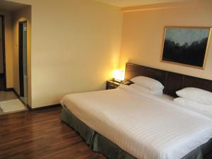 Cama o camas de una habitación en Dusit Hotel