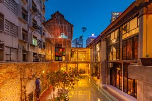 an alley in an old city at night at Mingle Highstreet in Kuala Lumpur