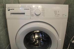 a washer and dryer in a bathroom at Cortile Maggiore Home in Cefalù