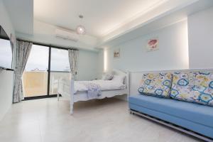 A bed or beds in a room at Iris Guest House