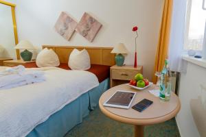 
Ein Bett oder Betten in einem Zimmer der Unterkunft Hotel Antares

