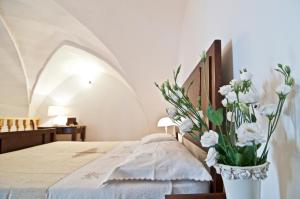 Een bed of bedden in een kamer bij Home Holiday Salento Casa Agrosì