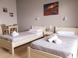 Posteľ alebo postele v izbe v ubytovaní George's Sea View Apartments
