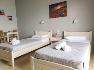 Posteľ alebo postele v izbe v ubytovaní George's Sea View Apartments