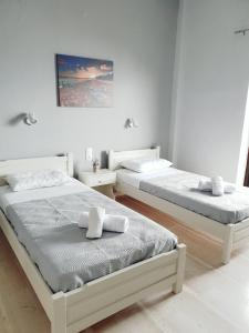 Posteľ alebo postele v izbe v ubytovaní George's Sea View Apartments