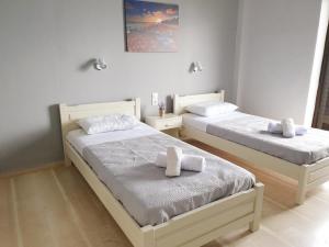 Posteľ alebo postele v izbe v ubytovaní George's Sea View Apartments