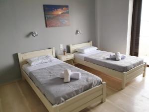 Posteľ alebo postele v izbe v ubytovaní George's Sea View Apartments