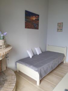Posteľ alebo postele v izbe v ubytovaní George's Sea View Apartments