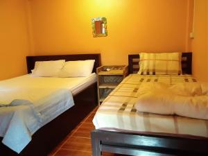 Postel nebo postele na pokoji v ubytování Ok Sukhothai Resort