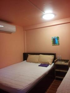 Postel nebo postele na pokoji v ubytování Ok Sukhothai Resort