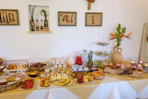 a table with many different types of food on it at Agriturismo Calamate in Gallipoli