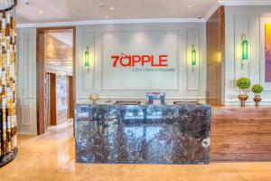 a store with a large aquarium in the middle of a room at 7 Apple Hotel - Viman Nagar Pune in Pune