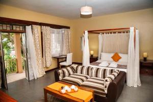 Postel nebo postele na pokoji v ubytování Papaya Holiday Home