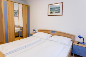 Łóżko lub łóżka w pokoju w obiekcie Appartement Graz - Ihr erstklassiges Zuhause fernab von Zuhause