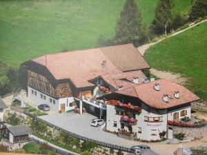 an aerial view of a large house with a roof at Unterwirtshof in Nova Ponente