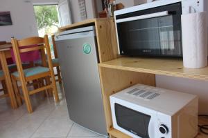 Kuchyň nebo kuchyňský kout v ubytování Aaron Studios Apartments