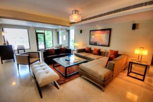 a living room with a couch and a table at 76 Friends Colony in New Delhi