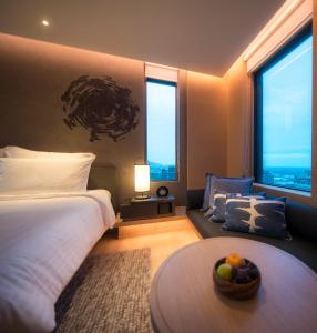 Katil atau katil-katil dalam bilik di MU Jiaoxi Hotel