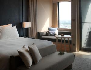 Katil atau katil-katil dalam bilik di MU Jiaoxi Hotel
