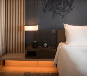 Katil atau katil-katil dalam bilik di MU Jiaoxi Hotel