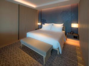 Katil atau katil-katil dalam bilik di MU Jiaoxi Hotel
