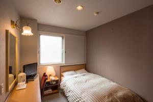 Postel nebo postele na pokoji v ubytování Oka Hotel