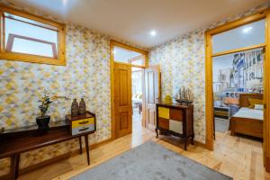 a room with a bedroom with a bed and a window at Varandas de Lisboa - Tejo River Apartments & Rooms in Lisbon