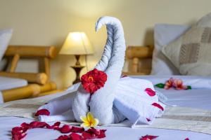 Postel nebo postele na pokoji v ubytování Kacu Ubud Inn