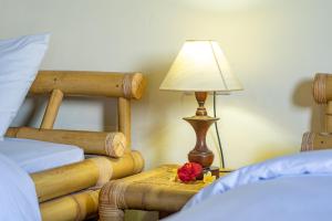 Postel nebo postele na pokoji v ubytování Kacu Ubud Inn
