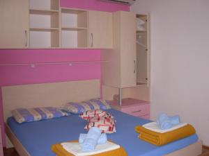 Postel nebo postele na pokoji v ubytování Apartments Kiro