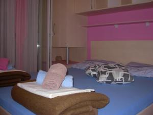 Postel nebo postele na pokoji v ubytování Apartments Kiro