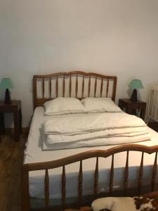 Säng eller sängar i ett rum på La Huberdière