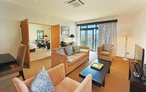 a living room with a couch and a table at La Fregate Hotel in St. Peter Port