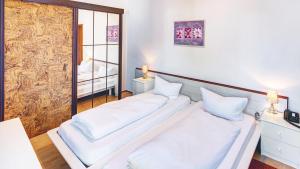 Postel nebo postele na pokoji v ubytování Hotel Cornelia