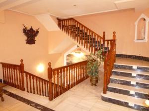 a staircase in a house with a potted plant at Hostal Madrid in Toledo