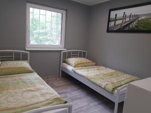 Posteľ alebo postele v izbe v ubytovaní Picurka Apartman + 19 fotografií