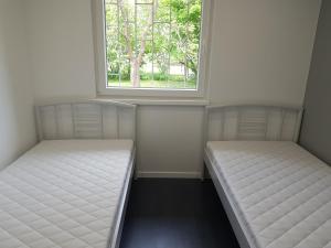 Posteľ alebo postele v izbe v ubytovaní Picurka Apartman