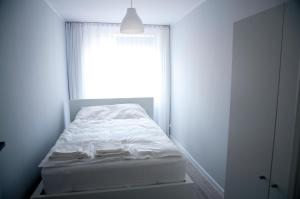 Posteľ alebo postele v izbe v ubytovaní Apartament Wiesio