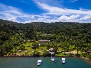 an aerial view of a resort with boats in the water at Waidroka Bay Resort in Korovou