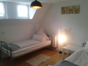 a living room with a couch and a table at Ferienwohnung Konrad - nahe Chemnitz in Limbach-Oberfrohna