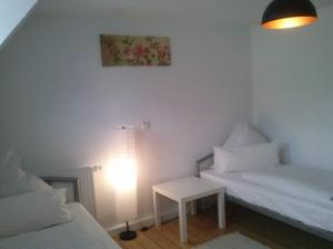 Una cama o camas en una habitación de Ferienwohnung Konrad - nahe Chemnitz