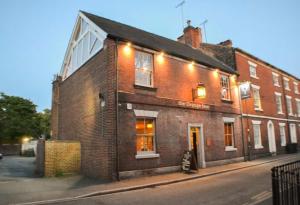 a brick building on the side of a street at St George Court, Spacious 2BR Apartments, City Centre, Self Check In, Parking, By DerBnB in Derby