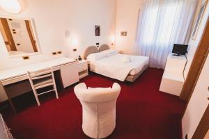Letto o letti in una camera di Grand Hotel Milano