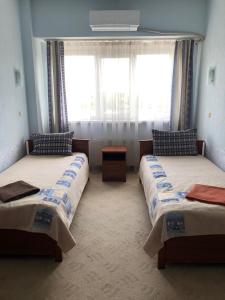 เตียงในห้องที่ Mini Hotel on Brovarskaya