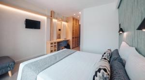 Postel nebo postele na pokoji v ubytování Minoa Hotel