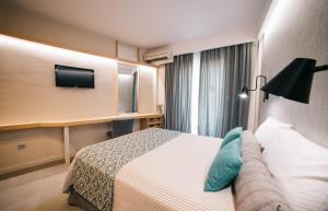 Postel nebo postele na pokoji v ubytování Minoa Hotel