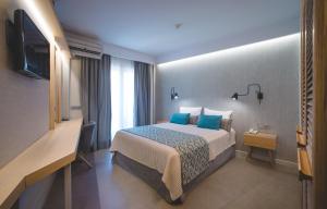 Postel nebo postele na pokoji v ubytování Minoa Hotel