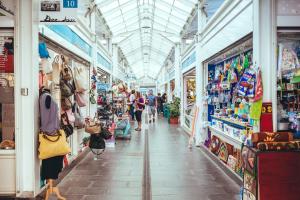 a market with people walking through the aisle of a store at Casa Ferrari Testaccio e Trastevere Wi-Fi free in Rome